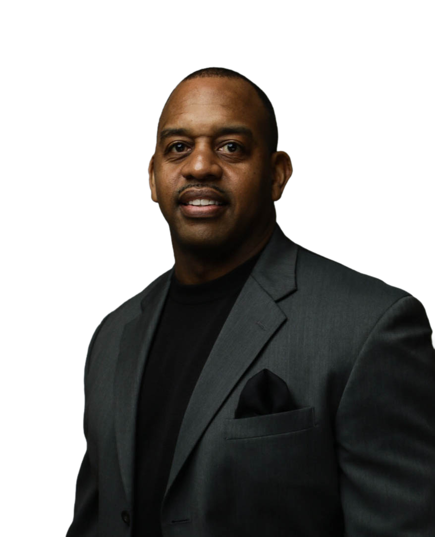 Dr. Picasso Nelson in a charcoal blazer with a black pocket square